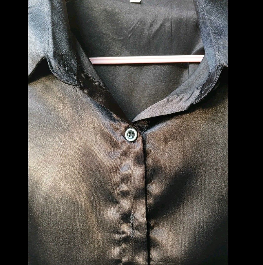 Black Satin Blouse (XL on tag) (Category: Blouses) located in Quezon City. Submitted by dyanella7 (Listing ID 1421819533, Image 3). Description: - Black satin blouse - Button-down design - Collared neckline - Long sleeves (rollable) - Suitable for formal and casual wear - Pairs well with jeans or skirts.