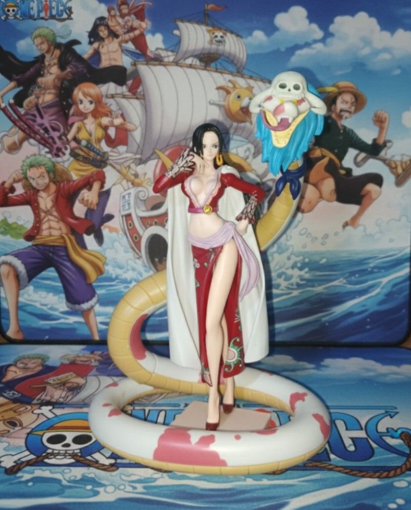 Boa Hancock with Salome Figure One Piece (Category: Figurines & Statues) located in Malabon City. Submitted by joeberg (Listing ID 1421910866, Image 1). Description: - Boa Hancock figure from One Piece. - Features Hancock standing on a snake. - Dynamic and detailed pose. - Vibrant colors. - Includes a circular patterned base. - Perfect for One Piece fans and collectors. -Bought in Bazaar for 950 php..