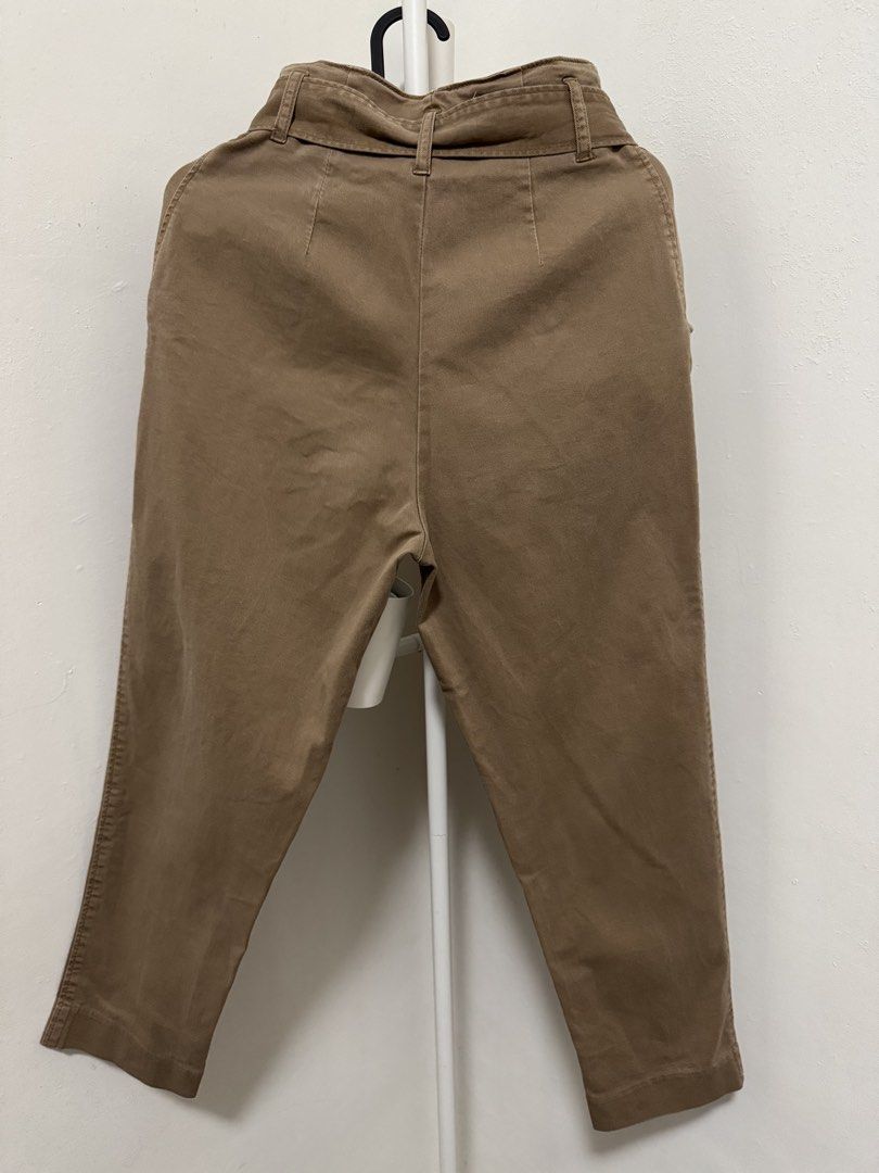 Brown Paper Bag Waist Pants (Category: Other Bottoms) located in Manila. Submitted by summer.731 (Listing ID 1421851584, Image 2). Description: Stylish brown pants with a paper bag waist design. Features a tie-waist detail and two front pockets. The pants have a cropped length and a tailored fit. The back of the pants has a clean, simple design. Perfect for creating a chic and versatile look..