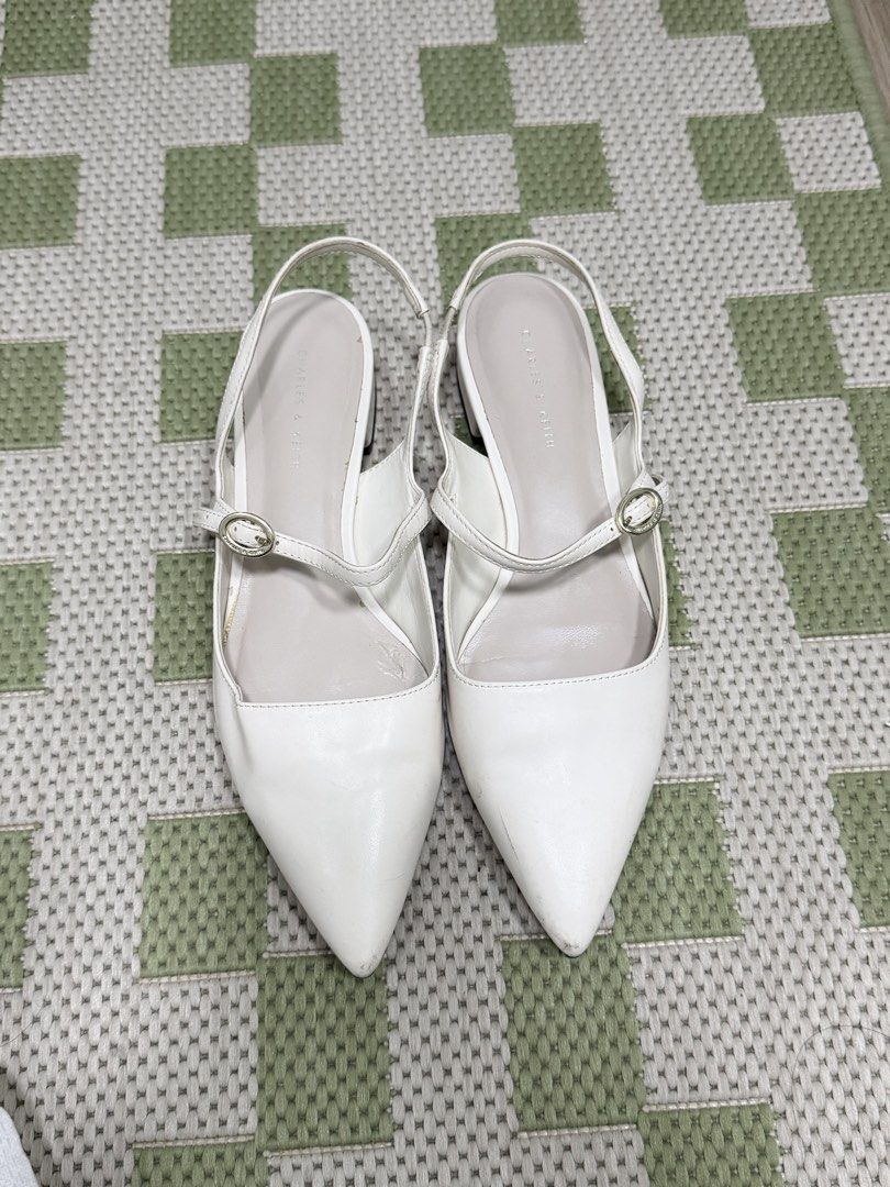 Charles & Keith White Sandals (Category: Flats & Sandals) located in Taguig. Submitted by issa23fourfive (Listing ID 1421872607, Image 1). Description: Issues: minor flaws on the soles that can be restored or cleaned from shoe cleaning shops..