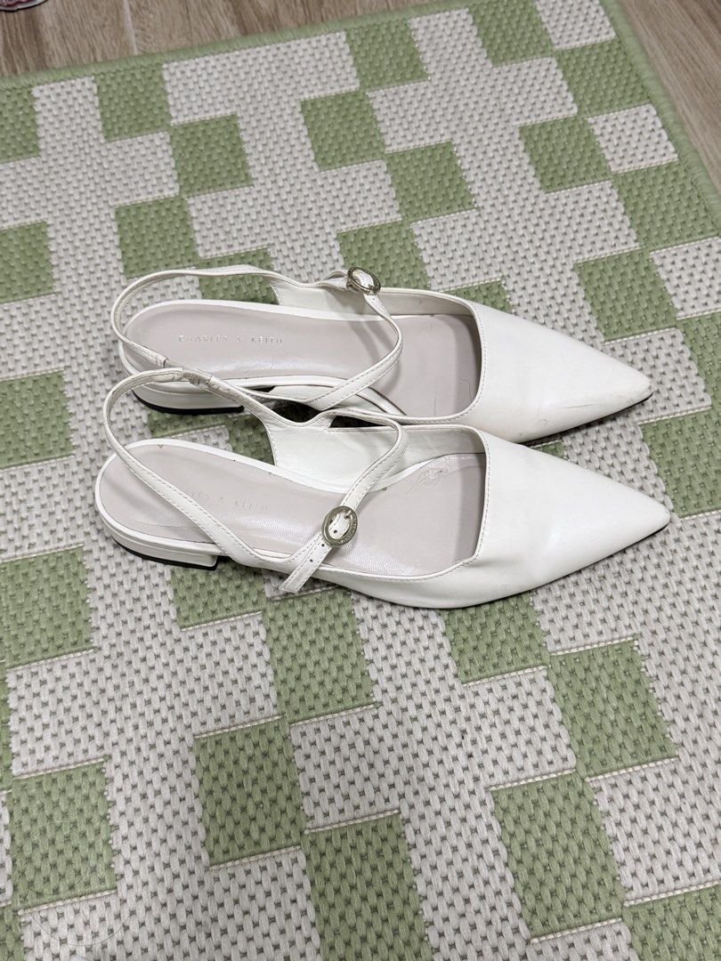 Charles & Keith White Sandals (Category: Flats & Sandals) located in Taguig. Submitted by issa23fourfive (Listing ID 1421872607, Image 2). Description: Issues: minor flaws on the soles that can be restored or cleaned from shoe cleaning shops..