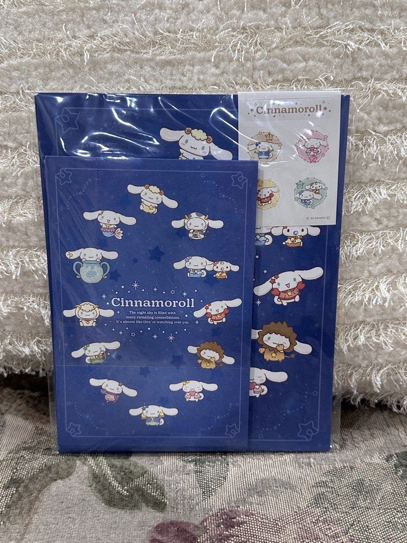 Cinnamoroll Stationery Set (Category: Stationery & School Supplies) located in Manila. Submitted by mybeadshop (Listing ID 1421832108, Image 2). Description: - Cinnamoroll Stationery Set - Includes: Envelope, Writing Pad, and Stickers - Color Scheme: Blue and White - Notepad: Dark blue cover with Cinnamoroll illustrations - Writing Pad: Features a pink border - Stickers: Various Cinnamoroll designs.