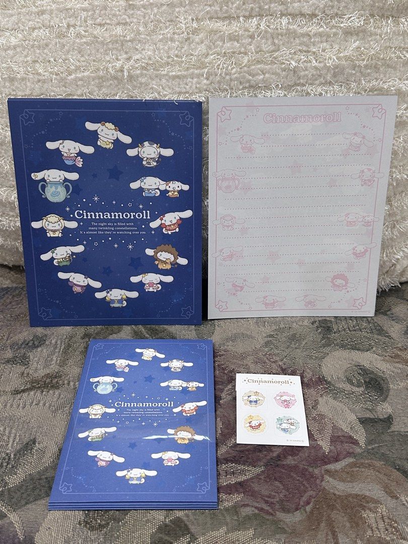 Cinnamoroll Stationery Set (Category: Stationery & School Supplies) located in Manila. Submitted by mybeadshop (Listing ID 1421832108, Image 1). Description: - Cinnamoroll Stationery Set - Includes: Envelope, Writing Pad, and Stickers - Color Scheme: Blue and White - Notepad: Dark blue cover with Cinnamoroll illustrations - Writing Pad: Features a pink border - Stickers: Various Cinnamoroll designs.