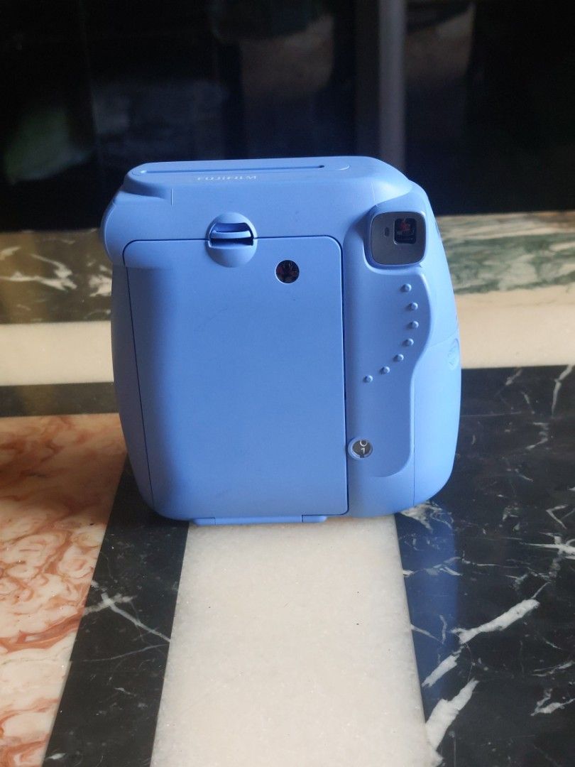 Fujifilm Instax Mini 9 - Blue(defective) (Category: Cameras) located in Manila. Submitted by jonrick.co (Listing ID 1421799942, Image 2). Description: - Fujifilm Instax Mini 9 instant camera - Color: Blue - Built-in flash - Compact and portable design - Easy to load film and batteries - Instant photo fun! defective forr repair or parts with power stuck up gear.