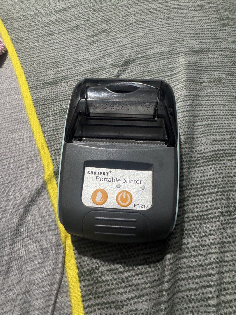 GOOJPRT PT-210 Portable Thermal Printer (Category: Printers, Scanners & Copiers) located in Caloocan City. Submitted by rayleighscloset (Listing ID 1421921822, Image 3). Description: The PT-210 Mobile Thermal Printer is your go-to solution for fast and efficient printing! With speeds reaching up to 80mm/s, this printer ensures you never have to wait long for your receipts, invoices, or tickets. Seamless Connectivity: Enjoy the freedom of wireless