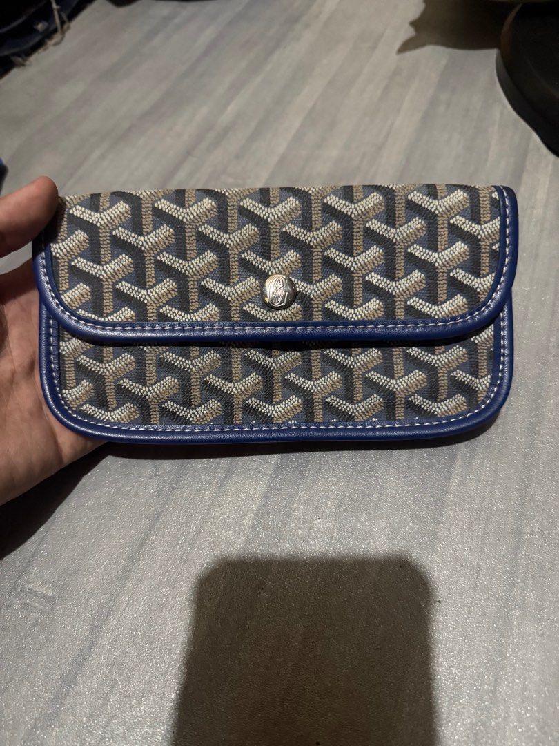Goyard Wallet (Category: Luxury Bags & Wallets) located in Cagayan de Oro. Submitted by twice.but.nice.blackmarket (Listing ID 1421876805, Image 1). Description: - Authentic Goyard wallet - Signature Goyardine canvas with blue leather trim - Blue leather interior - Goyard Paris Made in France stamp - Snap closure Flaws: May naputol na something na hawakan or steel sa likod search nyu nalang Ang original para ma identity po ninyu salamat. The desc