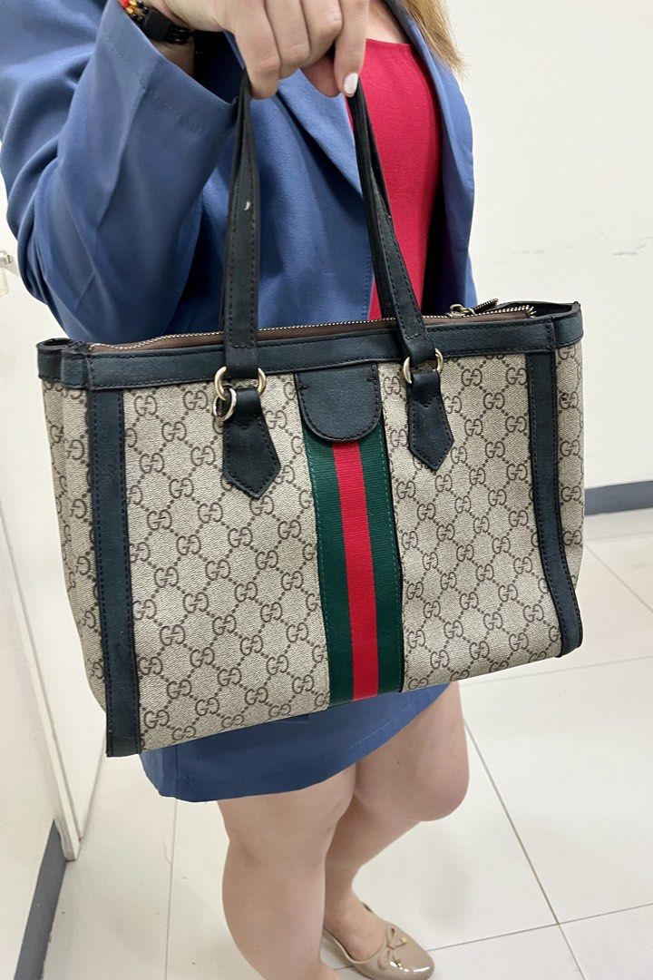 Gucci Ophidia Supreme Tote Bag (Category: Luxury Bags & Wallets) located in Pasig City. Submitted by zen_it_all (Listing ID 1421899517, Image 2). Description: - tote bag - Iconic GG Ophidia Supreme canvas - Green and red stripe detailing - Top handle design - Secure zip closure - Classic Gucci logo - With signs of use - no strap, replaced zipper but still with GG puller -some leather parts are sticky when touched and some are faded. -strictly plu