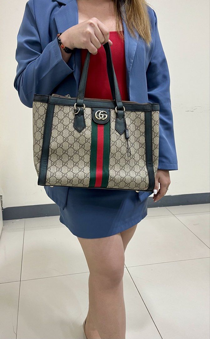 Gucci Ophidia Supreme Tote Bag (Category: Luxury Bags & Wallets) located in Pasig City. Submitted by zen_it_all (Listing ID 1421899517, Image 3). Description: - tote bag - Iconic GG Ophidia Supreme canvas - Green and red stripe detailing - Top handle design - Secure zip closure - Classic Gucci logo - With signs of use - no strap, replaced zipper but still with GG puller -some leather parts are sticky when touched and some are faded. -strictly plu