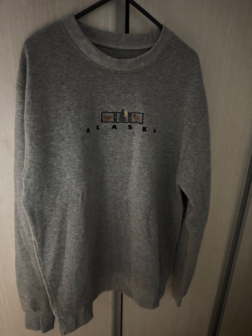 Han Ton Alaska Sweatshirt (Category: Coats, Jackets and Outerwear) located in Manila. Submitted by saintizzy (Listing ID 1421868978, Image 3). Description: - Gray Han Ton sweatshirt - Features "Alaska" embroidery on the front - Size: Medium - Crew neck and long sleeves - Simple design with animal and tree images - Rfs: decluttering.