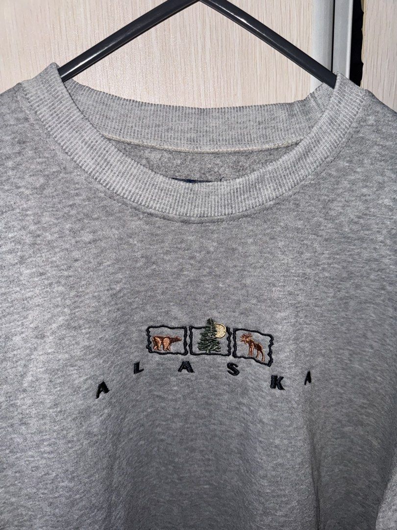 Han Ton Alaska Sweatshirt (Category: Coats, Jackets and Outerwear) located in Manila. Submitted by saintizzy (Listing ID 1421868978, Image 1). Description: - Gray Han Ton sweatshirt - Features "Alaska" embroidery on the front - Size: Medium - Crew neck and long sleeves - Simple design with animal and tree images - Rfs: decluttering.