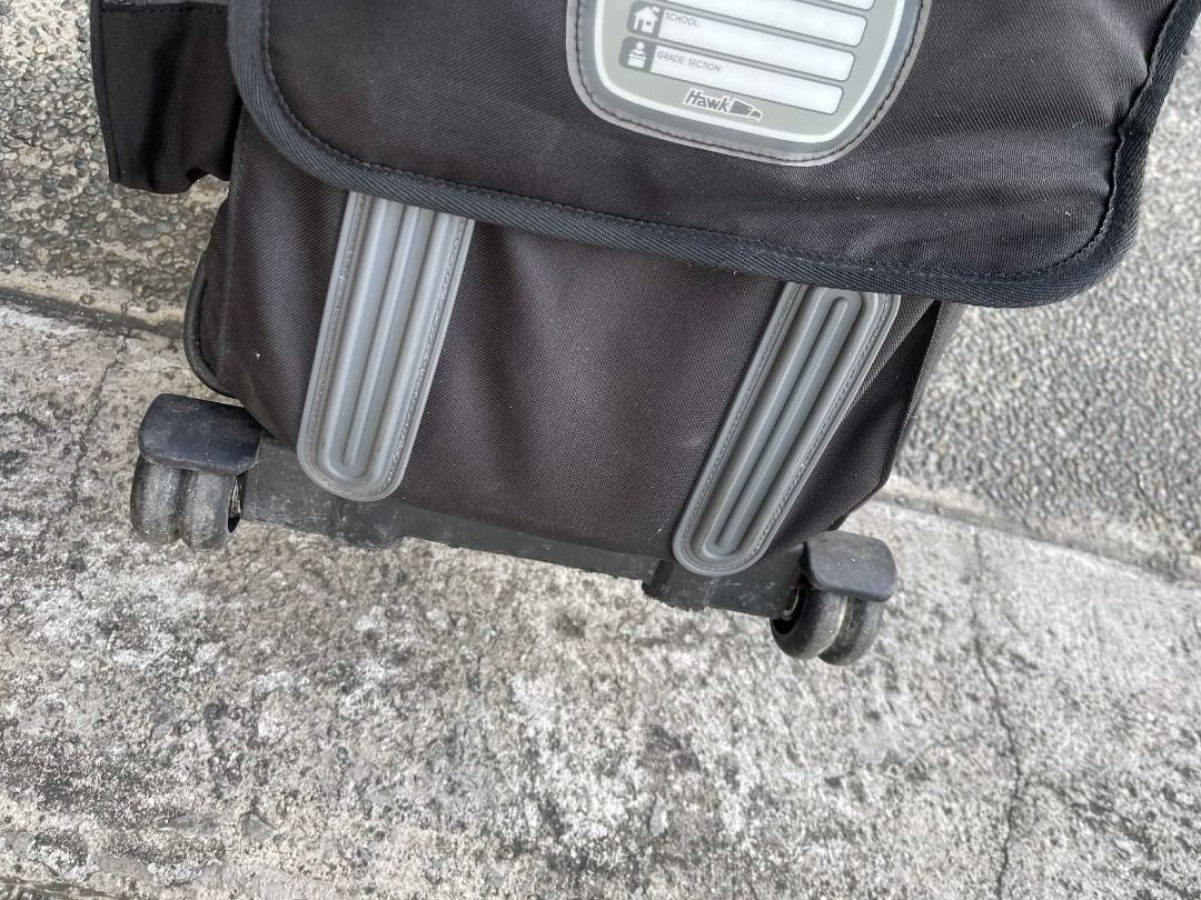 Hawk Rolling Backpack Stroller with Lunch Bag (Category: Backpacks) located in Bacoor. Submitted by krishna_boutiqueph (Listing ID 1421800260, Image 3). Description: - Hawk rolling backpack - Detachable lunch bag - Multiple compartments - Side pockets for water bottles - Retractable handle and wheels - Black and gray color - Virupro antimicrobial coating - Need Cleaning - Water tumbler not included Mall SRP Php 3,300.
