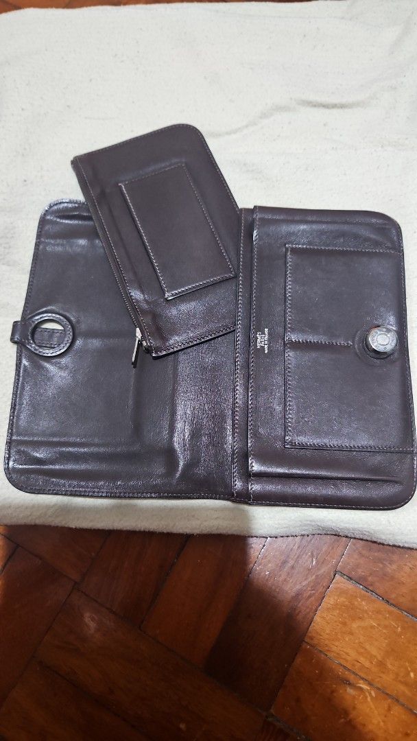 Hermes Leather Wallet (Category: Luxury Bags & Wallets) located in Manila. Submitted by allysa_trinkets (Listing ID 1421899780, Image 3). Description: - Authentic Hermes leather wallet - Dark brown color - Snap closure with Hermes logo - Multiple compartments - Removable coin purse - Made in France.