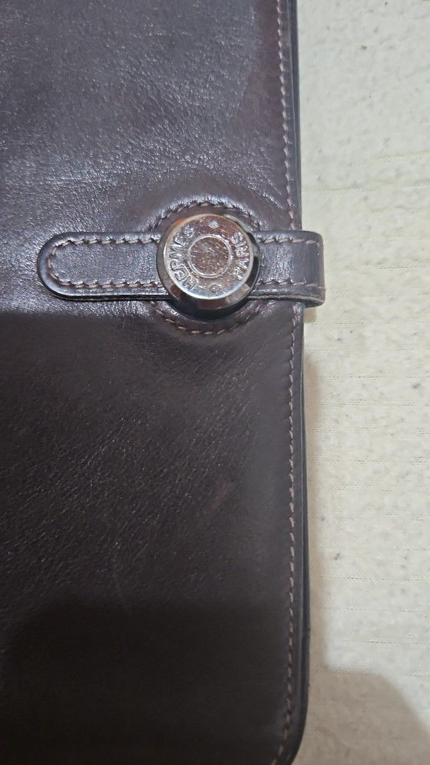 Hermes Leather Wallet (Category: Luxury Bags & Wallets) located in Manila. Submitted by allysa_trinkets (Listing ID 1421899780, Image 2). Description: - Authentic Hermes leather wallet - Dark brown color - Snap closure with Hermes logo - Multiple compartments - Removable coin purse - Made in France.