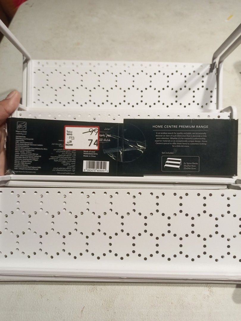Home Centre Monale 2-Piece Expandable Spice Rack (Category: Other Kitchenware & Tableware) located in Cavite. Submitted by ag_closet (Listing ID 1421881044, Image 3). Description: - 2-piece expandable spice rack from Home Centre. - It has a white finish with a perforated design. - The rack is designed to fit any space and can be used in the kitchen or pantry. - The dimensions are 25x24x13cm and 25x24x12cm. It is a great way to organize your spice