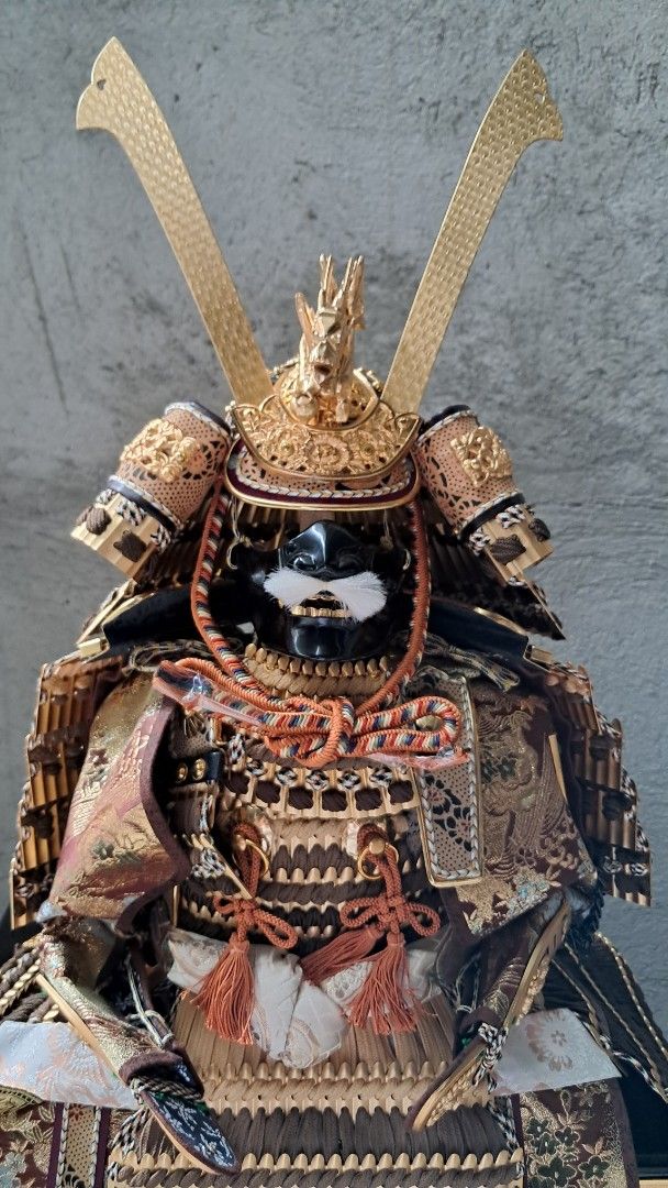 Japanese Samurai Armor Set Complete (Category: Vintage Collectibles) located in Balagtas. Submitted by misteramarijapansurplus (Listing ID 1421809045, Image 1). Description: - Complete Japanese Samurai Armor Set - Includes: Helmet, Chest Armor, Arm & Leg Guards, and Accessories - Displayed on a Black Lacquered Box5 - Features Intricate Details and Gold Accents - Well-Preserved Condition - Includes Display Stand and Additional Items Title : Japane