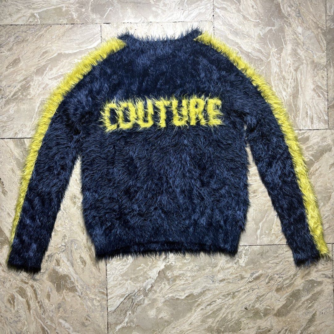 Juicy Couture Fluffy Sweater XS (Category: Coats, Jackets and Outerwear) located in Dinalupihan. Submitted by hell.thrift (Listing ID 1421914824, Image 2). Description: - Juicy Couture sweater - Size: XS -Length:23 -Width:16 - Features: Fluffy texture, "JUICY" or "COUTURE" across the front, yellow stripes on sleeves - Made in China - Material: 74% Polyamide, 24% Viscose, 2% Metallic Fiber.