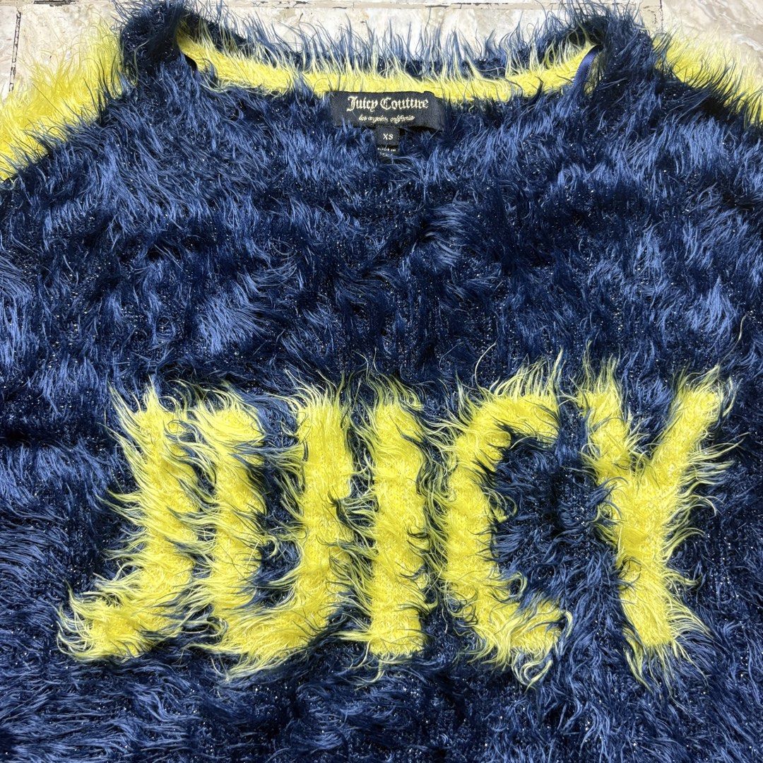 Juicy Couture Fluffy Sweater XS (Category: Coats, Jackets and Outerwear) located in Dinalupihan. Submitted by hell.thrift (Listing ID 1421914824, Image 3). Description: - Juicy Couture sweater - Size: XS -Length:23 -Width:16 - Features: Fluffy texture, "JUICY" or "COUTURE" across the front, yellow stripes on sleeves - Made in China - Material: 74% Polyamide, 24% Viscose, 2% Metallic Fiber.