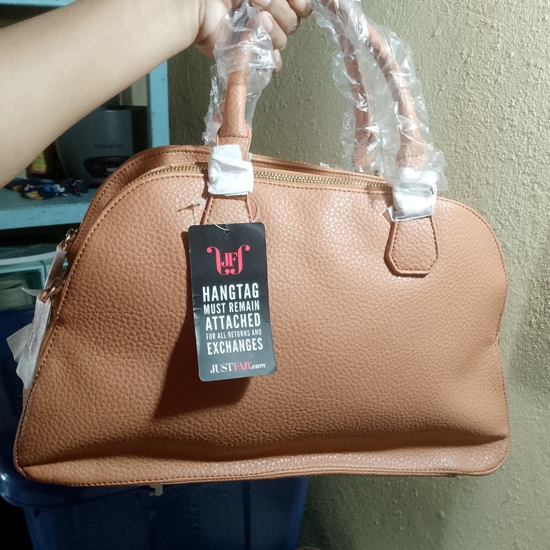 Handbag (Category: Shoulder Bags) located in Santa Maria. Submitted by avvvs (Listing ID 1421833067, Image 2). Description: - Tan handbag from Just Fab - Double zipper design - Gold-toned hardware - Striped interior lining - Interior zippered pocket - Includes hangtag (required for returns/exchanges) - Handles wrapped in plastic.