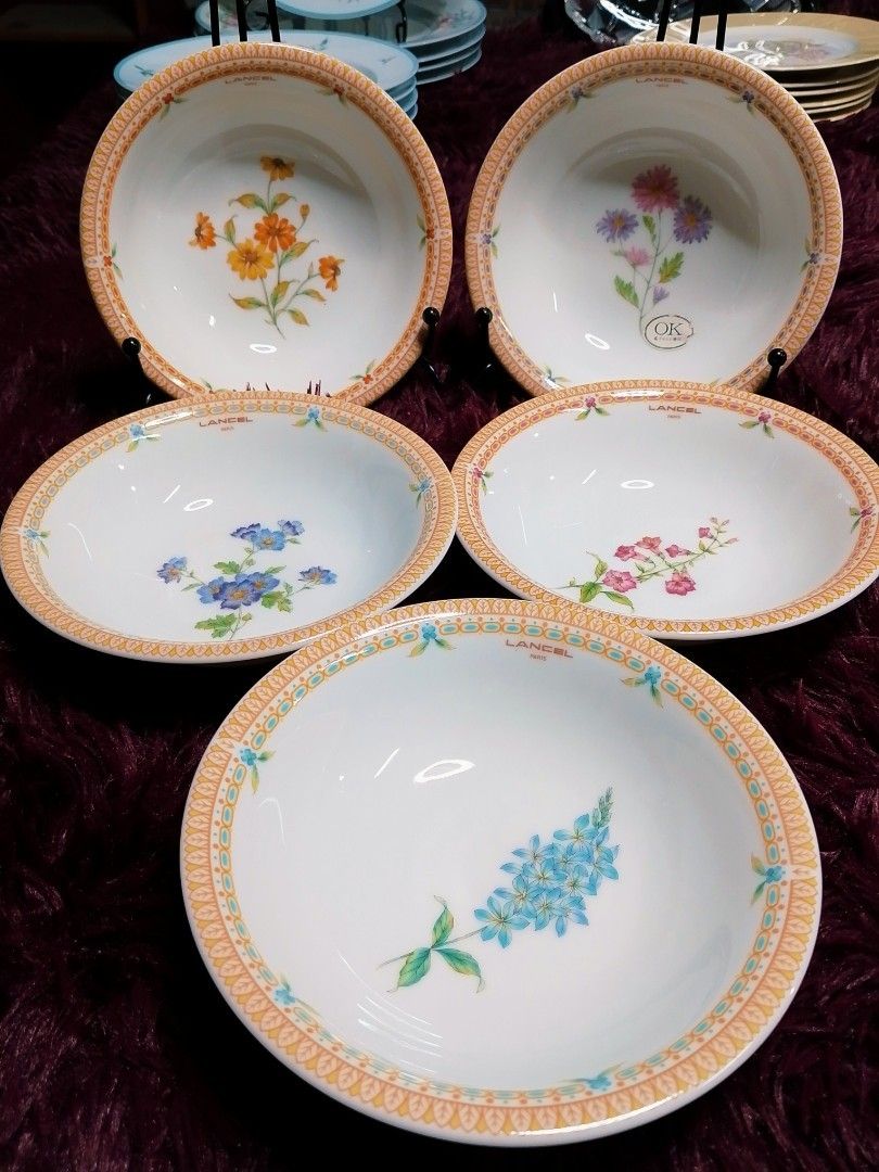 Lancel Floral Design Bowls (Category: Dinnerware & Cutlery) located in Cabanatuan. Submitted by miss.maia (Listing ID 1421855386, Image 1). Description: Set of Lancel bowls featuring floral designs. Each bowl has a decorative border. The bowls are white with various flower patterns in the center. The bowls are made in Japan. The diameter of the bowls is approximately 7 inches..