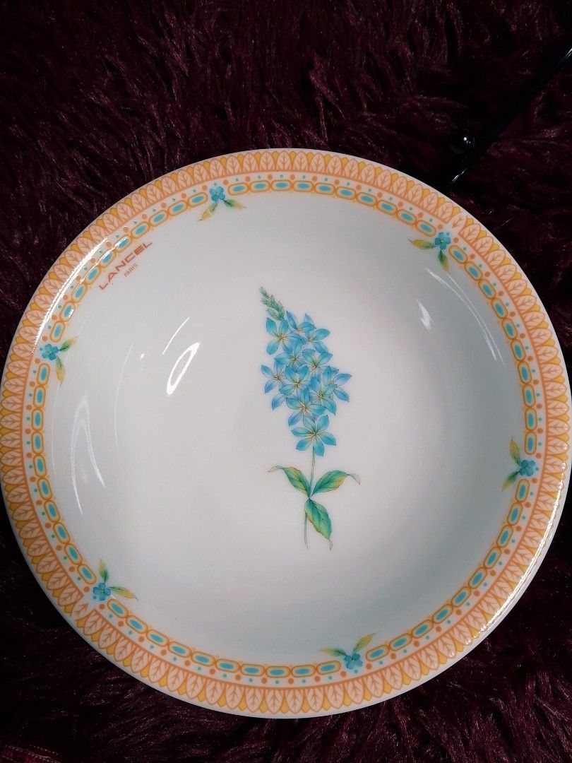 Lancel Floral Design Bowls (Category: Dinnerware & Cutlery) located in Cabanatuan. Submitted by miss.maia (Listing ID 1421855386, Image 2). Description: Set of Lancel bowls featuring floral designs. Each bowl has a decorative border. The bowls are white with various flower patterns in the center. The bowls are made in Japan. The diameter of the bowls is approximately 7 inches..