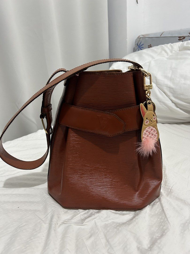 Louis Vuitton Epi Leather Bucket Bag (Category: Luxury Bags & Wallets) located in Quezon City. Submitted by bambibearnut (Listing ID 1421900812, Image 1). Description: - Authentic Louis Vuitton bucket bag - Epi Leather in brown color - Structured design - charm not included - Signature Epi leather texture Flaw - with leather cracks thus selling low.