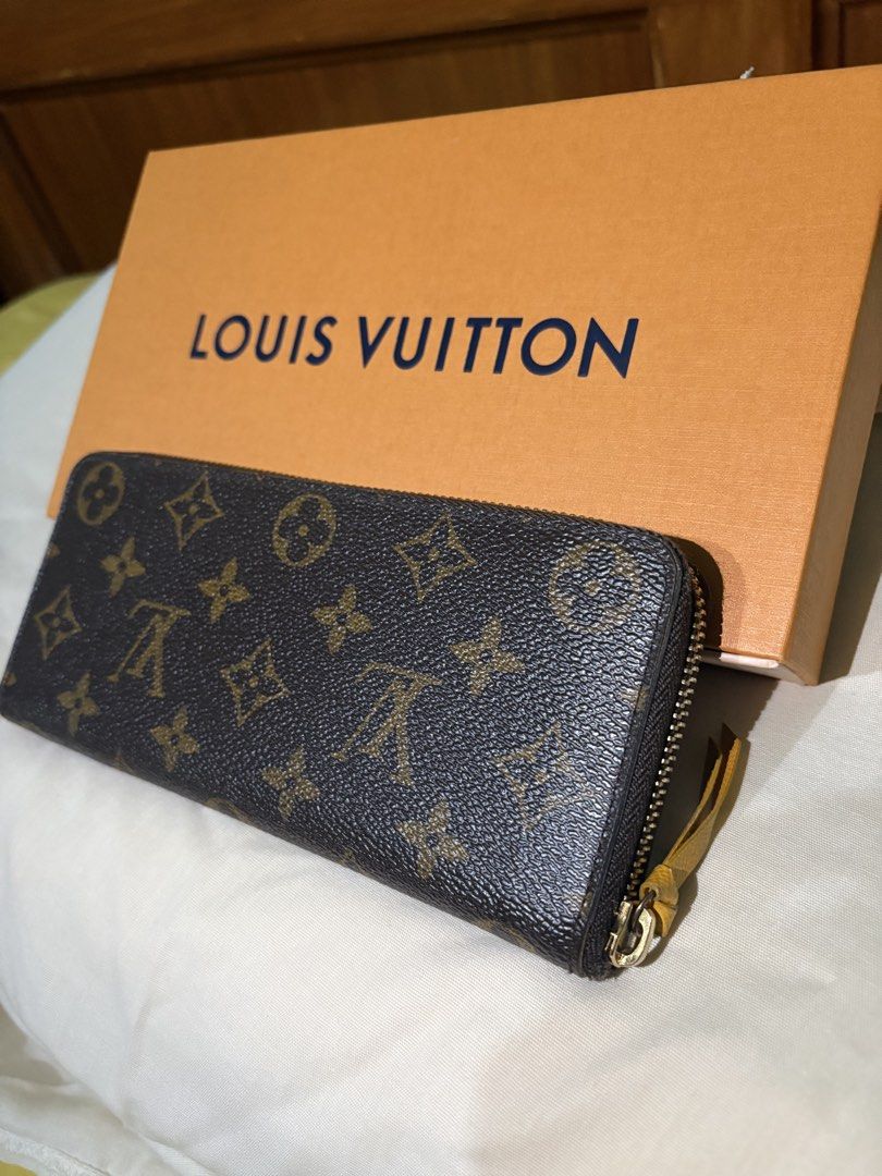 Louis Vuitton Zippy Wallet (Category: Luxury Bags & Wallets) located in Marikina City. Submitted by ellemss (Listing ID 1421917830, Image 2). Description: - Authentic Louis Vuitton Zippy Wallet - Iconic Monogram canvas exterior - Vibrant yellow interior - Comes with the original box - Features LV logo on zipper pull - Multiple card slots and compartments for cash and essentials.