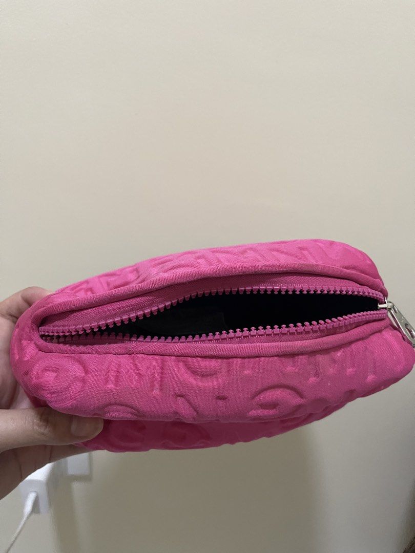 Mango Pink Cosmetic Bag (Category: Purses & Pouches) located in Manila. Submitted by _eahmczz (Listing ID 1421891402, Image 2). Description: - Mango pink cosmetic bag - Zip closure - Textured design with Mango logo - Black interior - Mango logo on zipper pull - Size: U - Model: 67740.