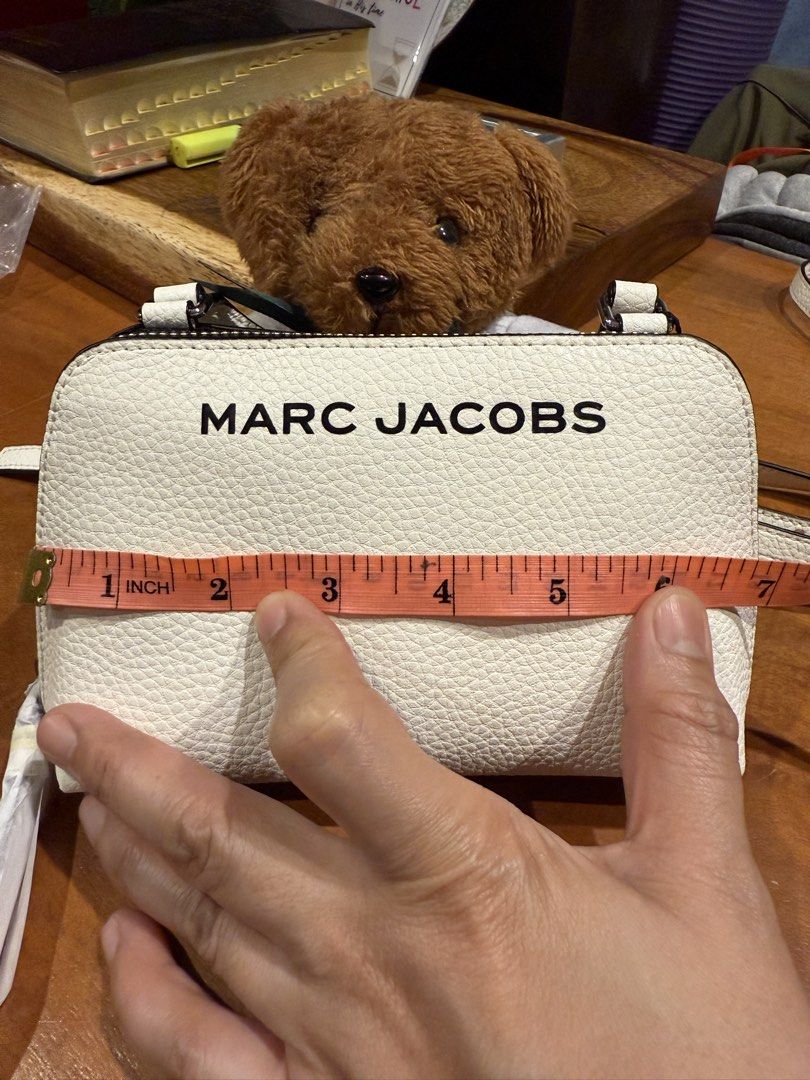 Marc Jacobs Crossbody Bag (Category: Luxury Bags & Wallets) located in Quezon City. Submitted by chrisma25 (Listing ID 1421938391, Image 2). Description: Brandnew with paper bag Limited version Leather mini bag 4 colors availble White Khaki Black Off white.