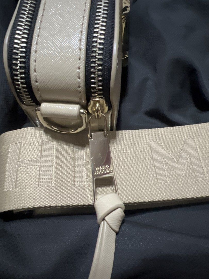Marc Jacobs The Snapshot Crossbody Bag (Category: Luxury Bags & Wallets) located in Taguig. Submitted by stuffitlikeitshot (Listing ID 1421883505, Image 3). Description: - Guaranteed ORIG from CA - Wide, branded, detachable strap - Double-zip closure - Exterior back pocket - Interior small pocket - Neutral color - Gold-tone hardware - FLAW- lipstick stain (last pic).
