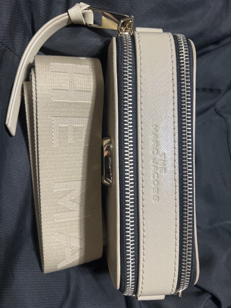 Marc Jacobs The Snapshot Crossbody Bag (Category: Luxury Bags & Wallets) located in Taguig. Submitted by stuffitlikeitshot (Listing ID 1421883505, Image 2). Description: - Guaranteed ORIG from CA - Wide, branded, detachable strap - Double-zip closure - Exterior back pocket - Interior small pocket - Neutral color - Gold-tone hardware - FLAW- lipstick stain (last pic).