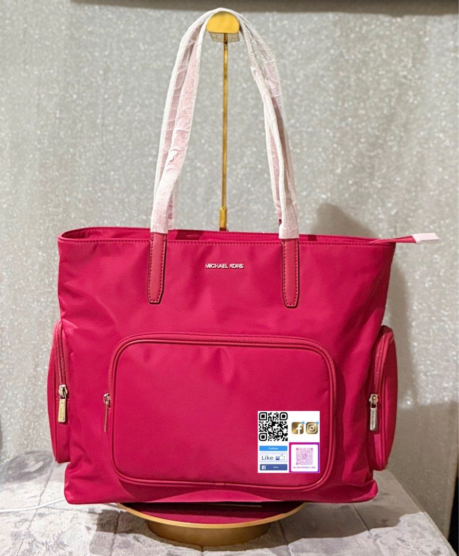 Michael Kors Tote Bag (Category: Luxury Bags & Wallets) located in Quezon City. Submitted by peachysexy1828 (Listing ID 1421915196, Image 2). Description: - Stylish Michael Kors tote bag - Available colors: Black, Pink, Blue, Beige - Large main compartment - Multiple exterior pockets - Includes shoulder straps - Perfect for everyday use or travel - Features the Michael Kors logo.
