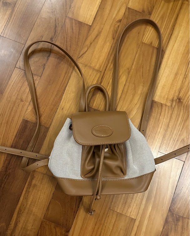 Mini Backpack with Drawstring Closure (Category: Backpacks) located in Singapore. Submitted by jrykamj (Listing ID 1421852944, Image 1). Description: - Stylish tan backpack - Drawstring and flap closure - Adjustable straps for comfort - Clean interior - Perfect for everyday use.