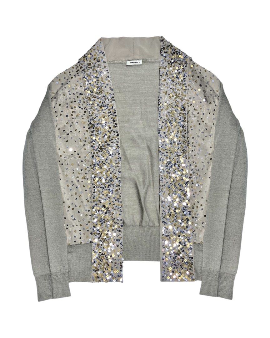 Miu Miu - Sequin-Trim Longline Cardigan (Category: Others Tops) located in Angeles City. Submitted by crushedgems (Listing ID 1421658488, Image 1). Description: id: Miu Miu - Sequin-Trim Longline Cardigan A sequin-embellished cardigan from Miu Miu. Made in a soft grey knit with a longline silhouette and open front, the piece is framed by dense sequin detailing along the edges and front panels. Its elongated cut lends a relaxed, fluid feel, while 