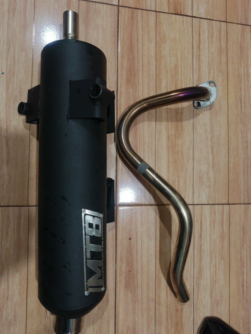 MTB Exhaust Pipe (Category: Construction & Building Materials) located in Pasig City. Submitted by jhunecoousel101902 (Listing ID 1421850473, Image 1). Description: - MTB exhaust pipe - Gold-colored pipe - Black muffler with MTB logo - Suitable for motorcycles.