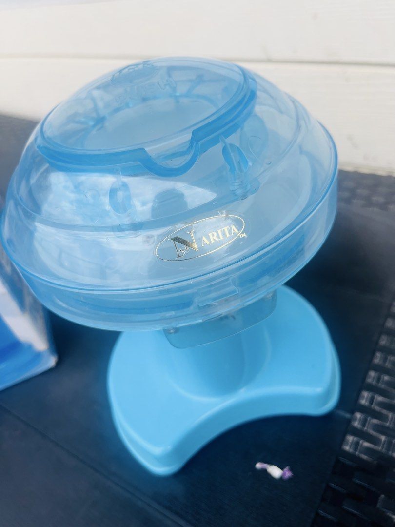 Narita Electric Ice Shaver Snow Cones Maker (Category: Other Kitchenware & Tableware) located in Subic. Submitted by mr_niceguy001 (Listing ID 1421840861, Image 3). Description: Make your own snow cones with this electric ice shaver from Narita. The unit is blue and comes with its original box. Perfect for making refreshing treats at home. The box shows images of snow cones. Model number is NB-2608. Note : 110 volts We bought it $30.