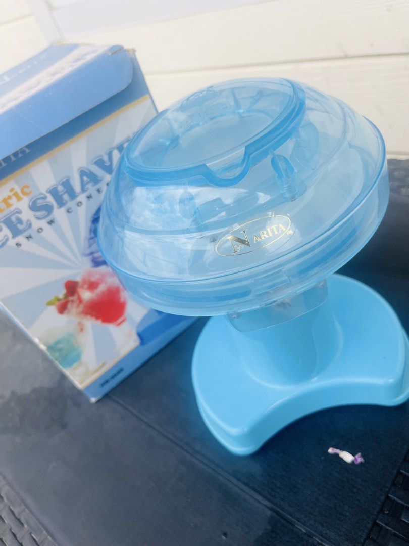 Narita Electric Ice Shaver Snow Cones Maker (Category: Other Kitchenware & Tableware) located in Subic. Submitted by mr_niceguy001 (Listing ID 1421840861, Image 1). Description: Make your own snow cones with this electric ice shaver from Narita. The unit is blue and comes with its original box. Perfect for making refreshing treats at home. The box shows images of snow cones. Model number is NB-2608. Note : 110 volts We bought it $30.