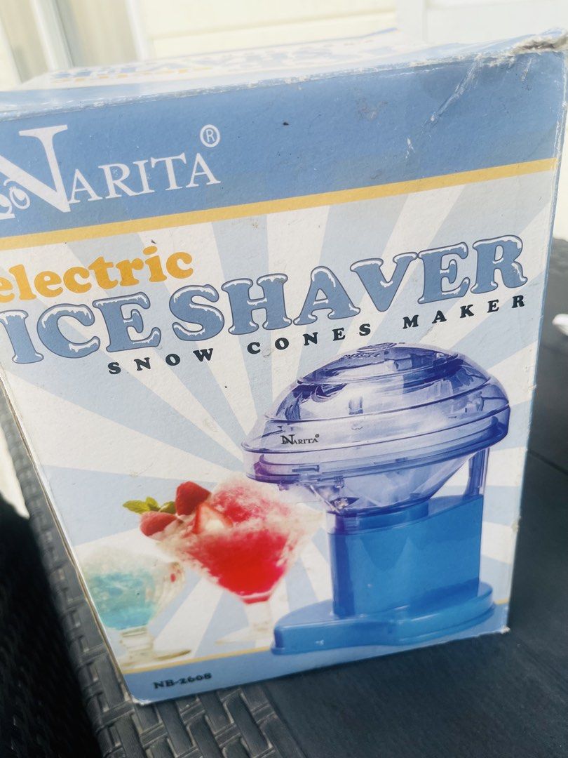 Narita Electric Ice Shaver Snow Cones Maker (Category: Other Kitchenware & Tableware) located in Subic. Submitted by mr_niceguy001 (Listing ID 1421840861, Image 2). Description: Make your own snow cones with this electric ice shaver from Narita. The unit is blue and comes with its original box. Perfect for making refreshing treats at home. The box shows images of snow cones. Model number is NB-2608. Note : 110 volts We bought it $30.