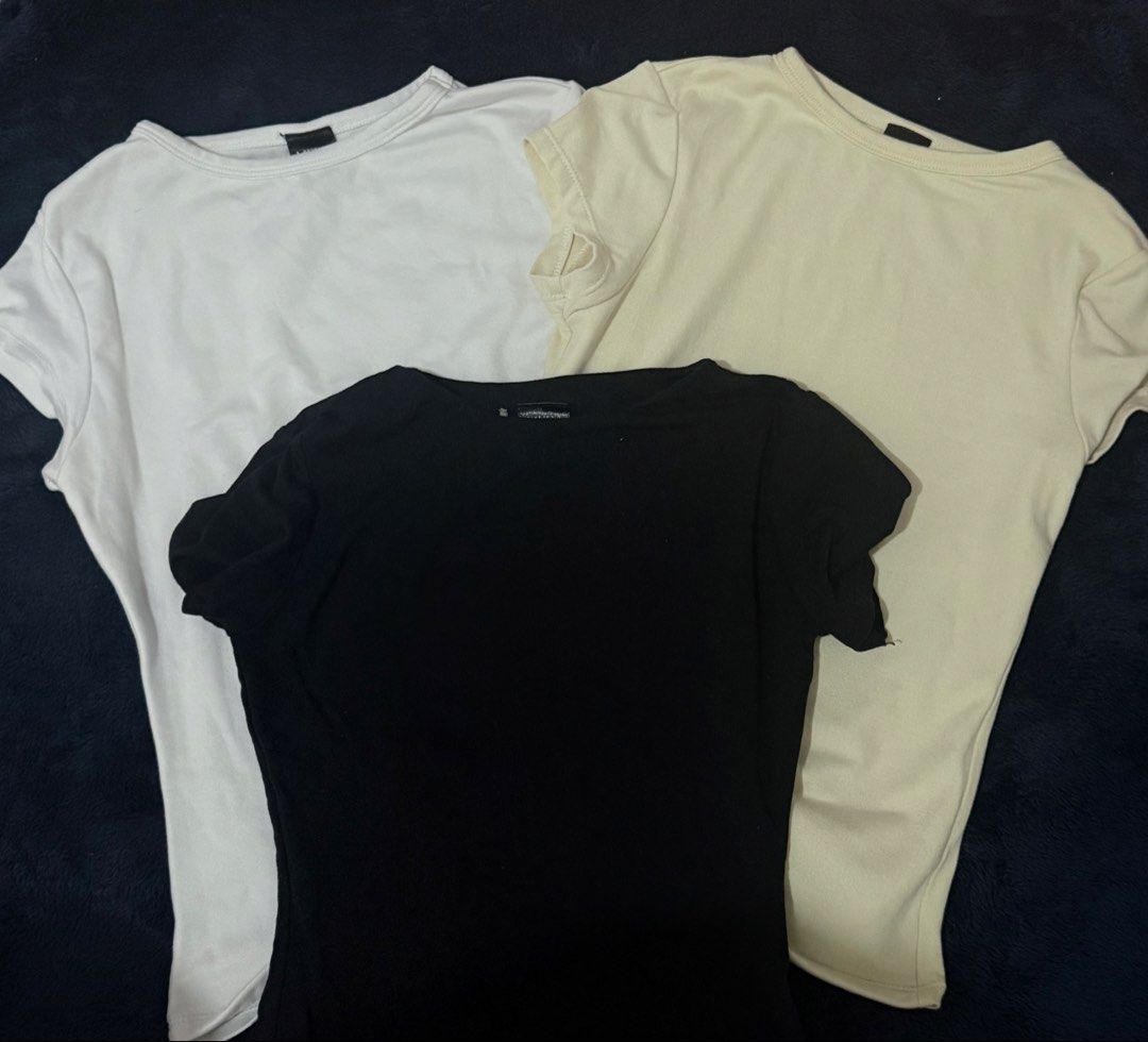 Neutral Body-fitting Shirts Bundle (Category: Shirts) located in Manila. Submitted by adrianabanana (Listing ID 1421903394, Image 1). Description: - Sizes: XS-S - Neutral body-fitting shirt bundle. - Includes white, black, and cream colors. - Body-hugging design. - Comfortable material. - Perfect for layering or wearing alone..