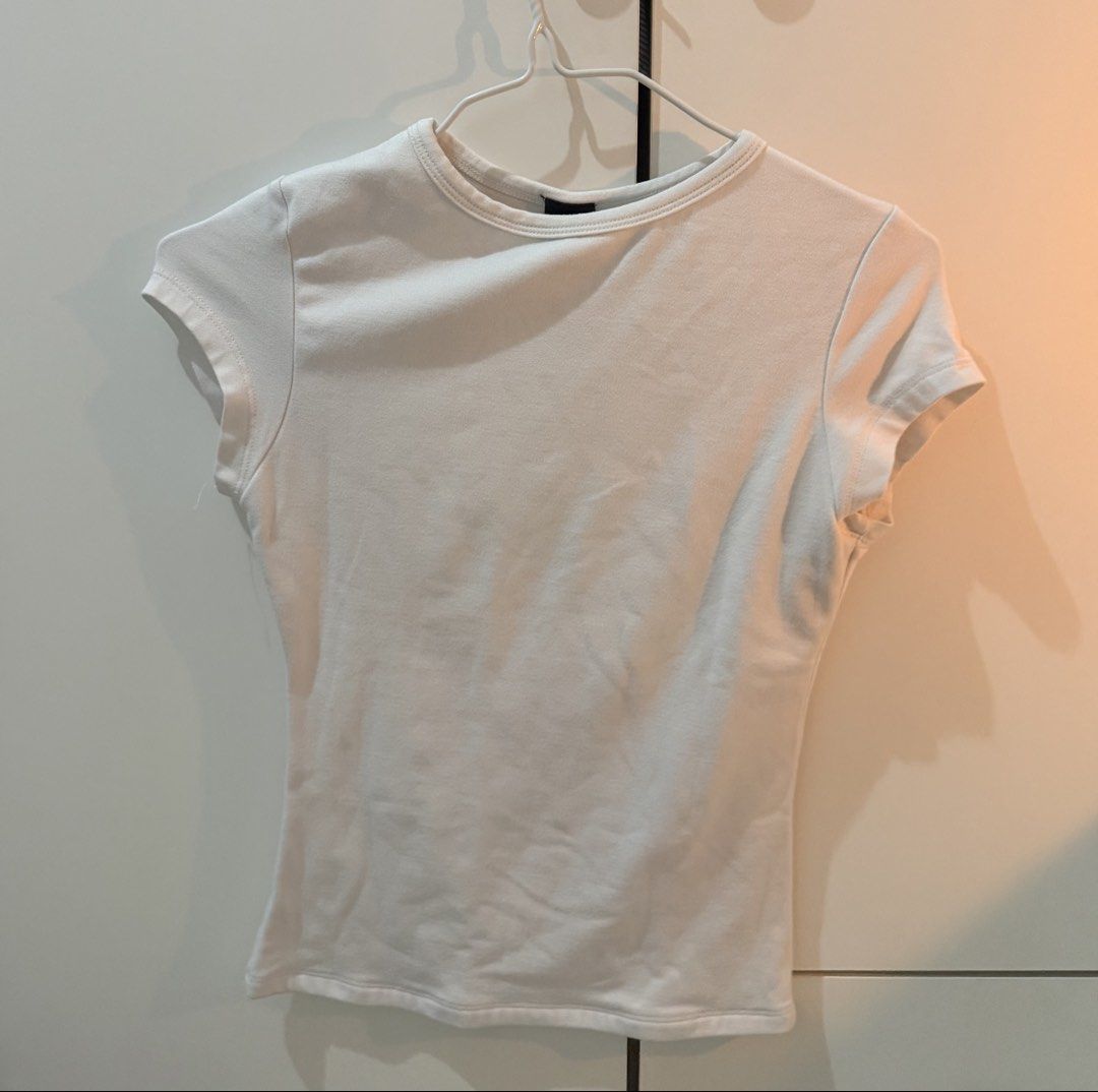 Neutral Body-fitting Shirts Bundle (Category: Shirts) located in Manila. Submitted by adrianabanana (Listing ID 1421903394, Image 3). Description: - Sizes: XS-S - Neutral body-fitting shirt bundle. - Includes white, black, and cream colors. - Body-hugging design. - Comfortable material. - Perfect for layering or wearing alone..