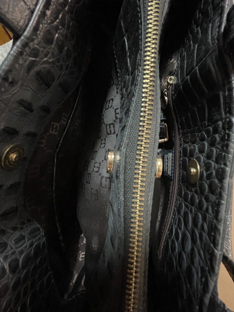 Nicole Miller Black Crocodile Handbag (Category: Luxury Bags & Wallets) located in Cavite. Submitted by marshwind (Listing ID 1421918675, Image 3). Description: Original Nicole Miller Bag Small size. Fits long wallet and promax phone. Crocodile leather Black Used but not abused. Very good condition. .