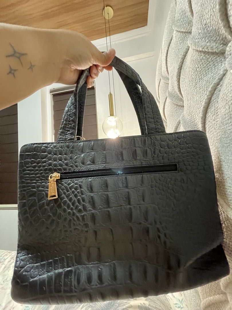 Nicole Miller Black Crocodile Handbag (Category: Luxury Bags & Wallets) located in Cavite. Submitted by marshwind (Listing ID 1421918675, Image 2). Description: Original Nicole Miller Bag Small size. Fits long wallet and promax phone. Crocodile leather Black Used but not abused. Very good condition. .