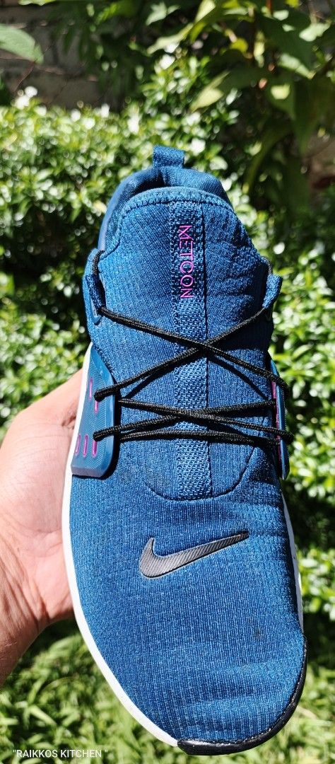 Nike Free RN Flyknit 3.0 Blue Sneakers (Category: Sneakers) located in Prosperidad. Submitted by jaybejoc1001 (Listing ID 1421910564, Image 2). Description: Nike Free RN Flyknit 3.0 sneakers in blue. Features a breathable Flyknit upper with black laces and a Nike swoosh logo. The sole is white and black with a unique honeycomb pattern. The heel has "NIKE FREE" printed on it. The shoes have a pull tab at the back for easy wear..