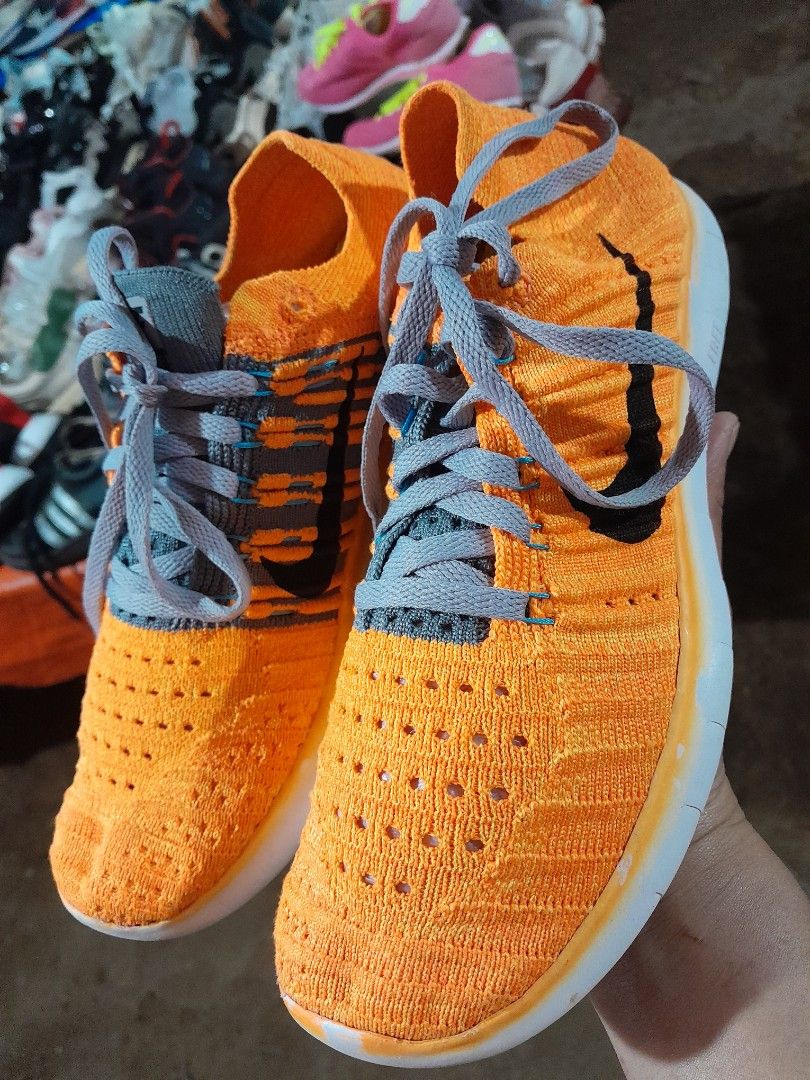 Nike Free RN Flyknit Orange Sneakers (Category: Sneakers) located in Molave. Submitted by nel95 (Listing ID 1421860934, Image 2). Description: - Nike Free RN Flyknit sneakers - Color: Orange - Features grey laces and white sole - Size: US 6, UK 3.5, EUR 36.5, 23 cm - Nike logo visible - Made in China.