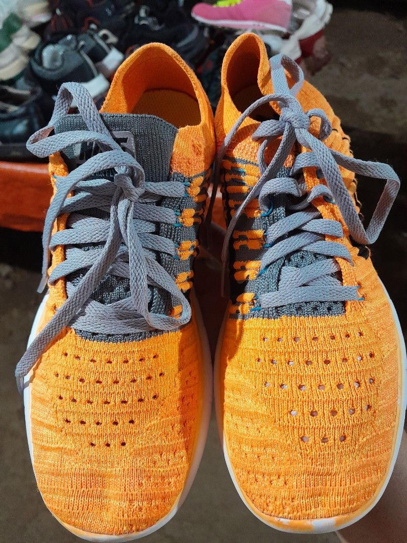 Nike Free RN Flyknit Orange Sneakers (Category: Sneakers) located in Molave. Submitted by nel95 (Listing ID 1421860934, Image 1). Description: - Nike Free RN Flyknit sneakers - Color: Orange - Features grey laces and white sole - Size: US 6, UK 3.5, EUR 36.5, 23 cm - Nike logo visible - Made in China.