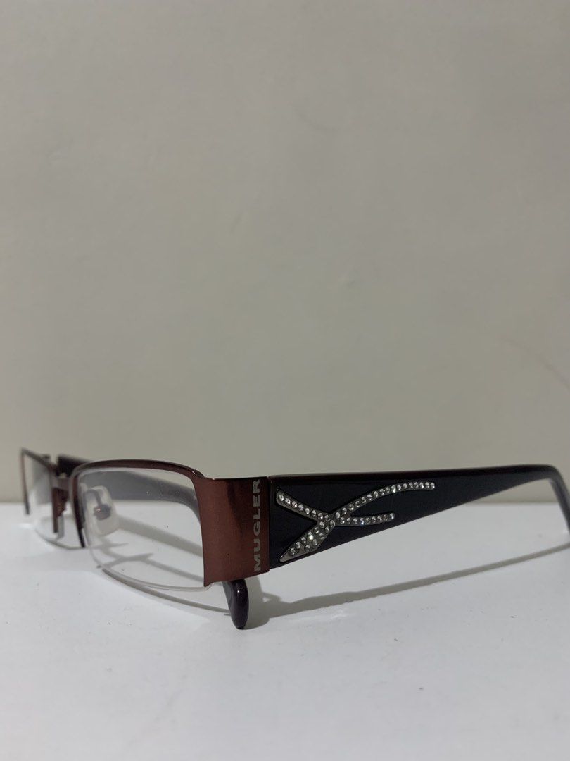 [RUSH] Original Thierry Mugler Bayonetta Eyeglasses (Dark Red) (Category: Sunglasses & Eyewear) located in San Mateo. Submitted by bluhydrangea (Listing ID 1421934656, Image 3). Description: PRICE LOWERED RUSH Thierry Mugler Bayonetta eyeglasses Dark red frame with Y2K crystal embellishments Mugler logo visible Like new condition No grade, changeable lenses.