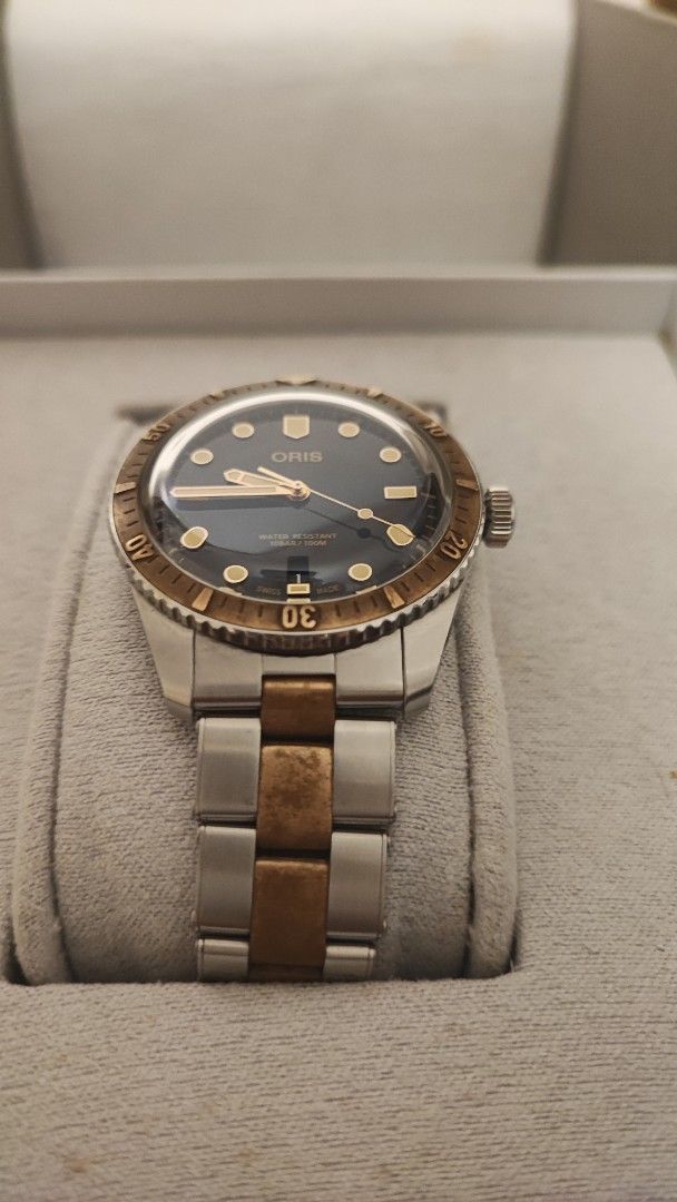 Oris Divers Sixty-Five Automatic Watch (Category: Men's Watches) located in Cebu City. Submitted by petegohan (Listing ID 1421904820, Image 2). Description: Personal seller, not a professional resseller. Well maintained watches, properly stored, down sizing collection Oris Divers Sixty-Five automatic watch known as "Bi-co" bi-color two tone bronze and stainless watch with a blue dial and classic proportions of the divers 65 + domed sapphire cryst