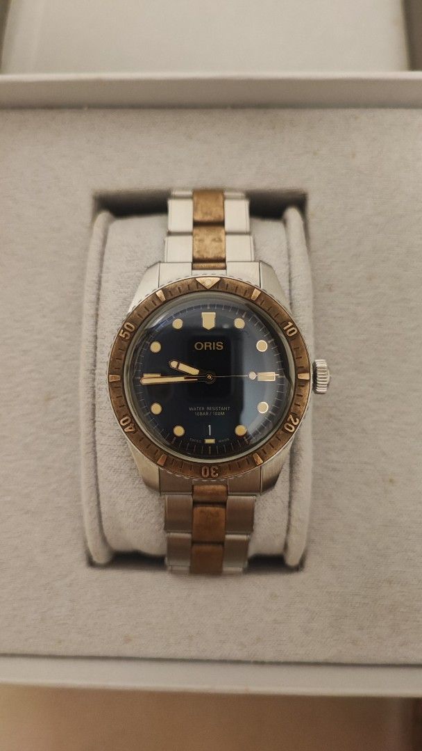 Oris Divers Sixty-Five Automatic Watch (Category: Men's Watches) located in Cebu City. Submitted by petegohan (Listing ID 1421904820, Image 1). Description: Personal seller, not a professional resseller. Well maintained watches, properly stored, down sizing collection Oris Divers Sixty-Five automatic watch known as "Bi-co" bi-color two tone bronze and stainless watch with a blue dial and classic proportions of the divers 65 + domed sapphire cryst
