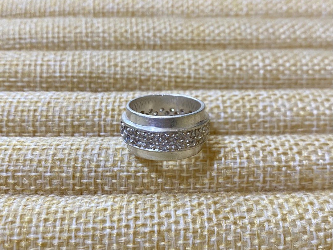 Piaget or Spinner Ring | S925 (Category: Rings) located in Solano. Submitted by silvershineph (Listing ID 1421839219, Image 2). Description: ✧ Product / Item Name: Piaget or Spinner Ring ✧ Description: A wide band ring featuring a distinctive central section with a 3-row pavé set of round-cut stones, likely cubic zirconia. ✧ Size: 5 ✧ Weight: 7.6g ✧ Details: • Genuine silver • Carefully inspected quality • Ready for shipment For inquiries or rese