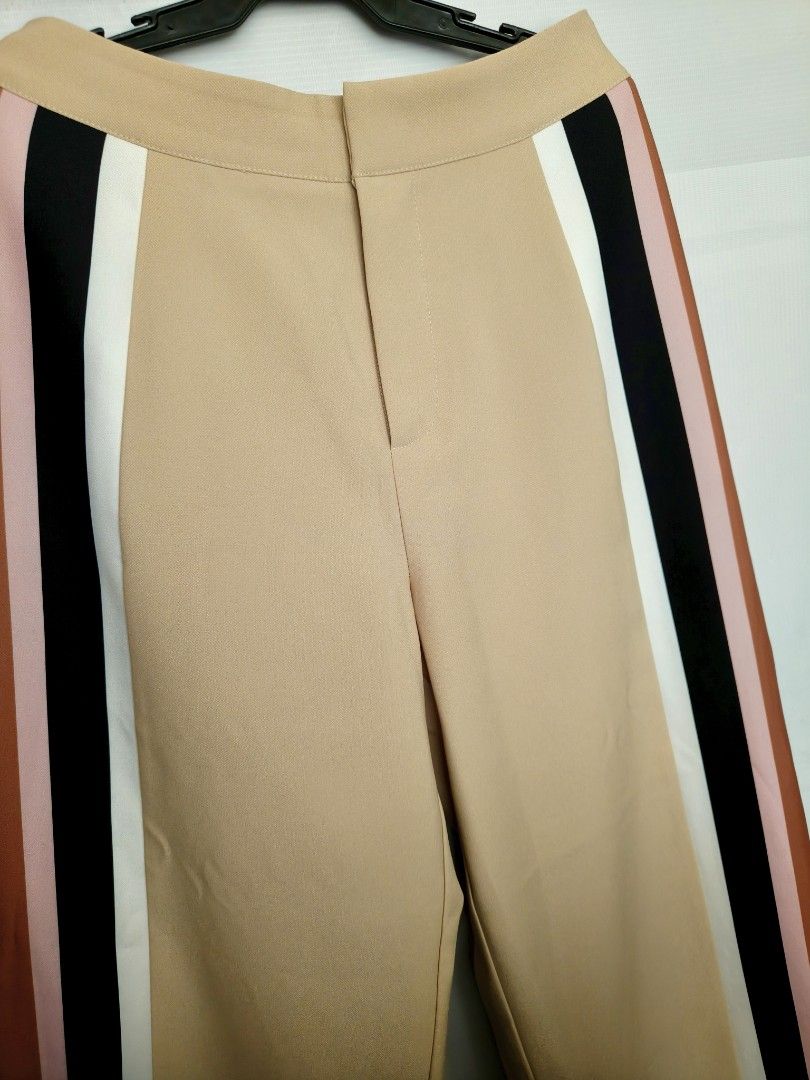 Plains & Prints Sleeveless Top and Pants Set (Category: Sets or Coordinates) located in Batangas. Submitted by 2mspreloved (Listing ID 1421809792, Image 3). Description: - Plains & Prints matching set - Sleeveless top with color-block design - Beige pants with color-block side stripes -With side pockets .