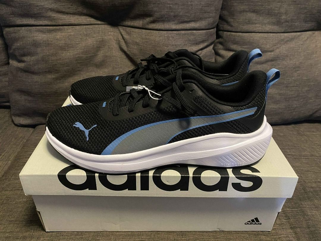 PUMA MEN'S ROCKET FUEL Running Sneakers (Category: Sneakers) located in Rizal. Submitted by TheRetailAddict (Listing ID 1421869886, Image 2). Description: - Black Puma running shoes - Blue accents - White sole - Puma logo on the side - Unworn condition (brand new) .